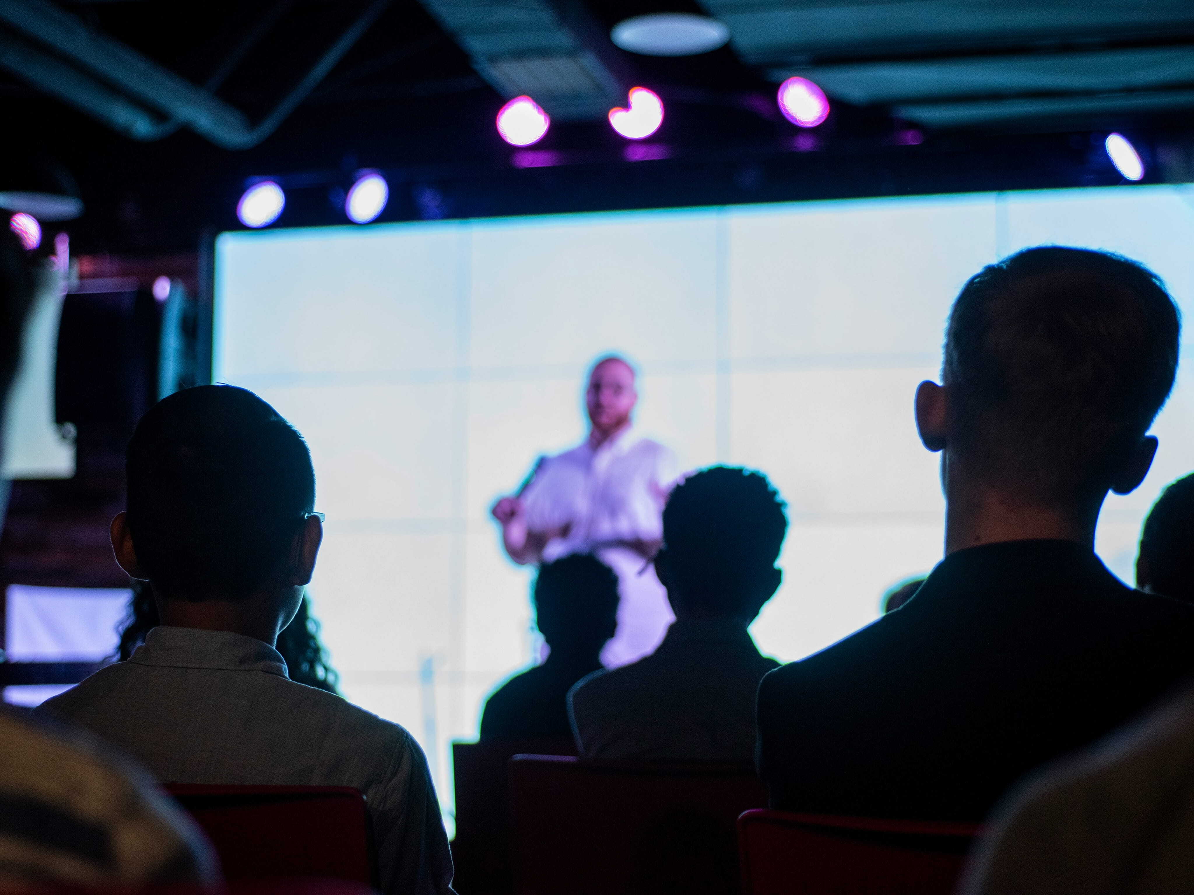 Speaker presenting at a conference