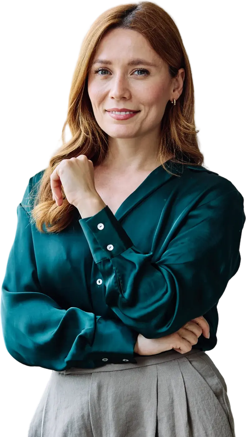 Smiling professional woman in a teal blouse